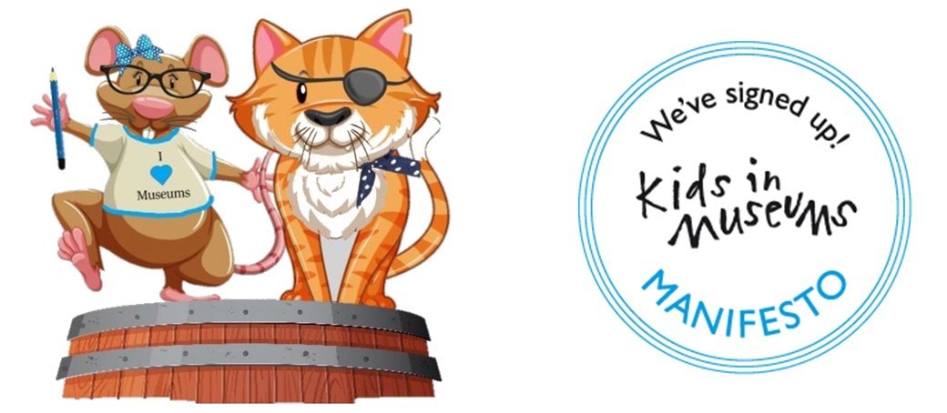 Logo from 'Kids in Museums' alongside the museum mascots: Cartoon images of Mabel the Museum Mouse wearing glasses and a T-shirt reading 'I love museums', alongside Maritime Monty, a ginger cat with a piratical eyepatch and spotted blue neckcloth.